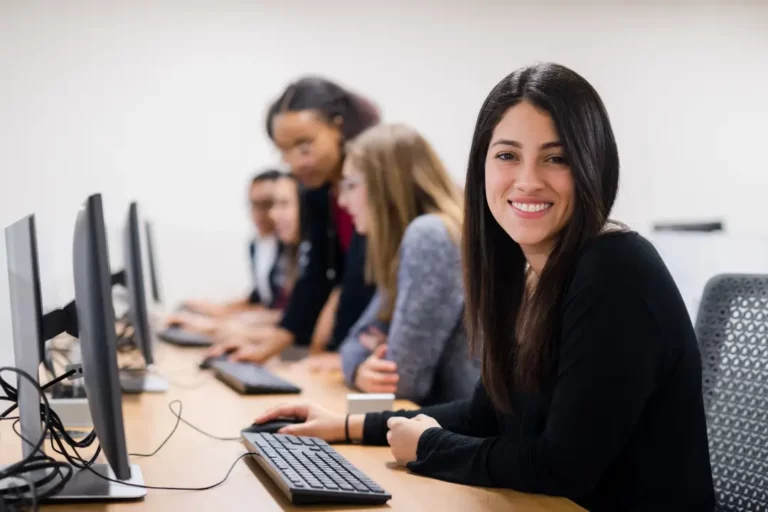 High school students at computers.
