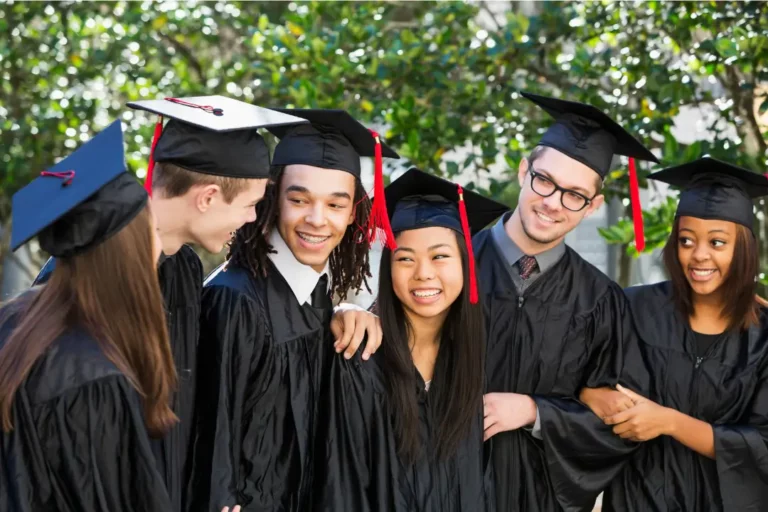 6 high school graduates in caps and gowns