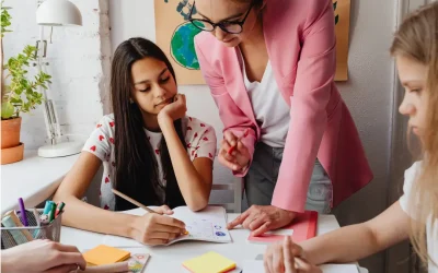 students getting tutored by a teacher